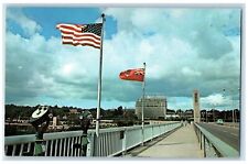 c1950's Entering Canada Rainbow Bridge Flags Niagara Falls Canada Postcard picture
