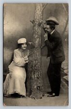 Antique c1910 Postcard Couple Being Playful Around Tree Dressed Nicely picture