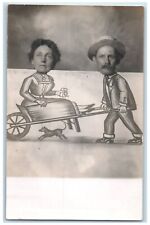 c1910s Caricature Man Woman Wheelbarrow Dog RPPC Photo Unposted Antique Postcard picture