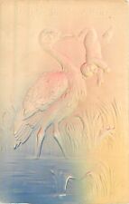 Embossed Airbrush Postcard Wetlands Stork holds Baby Upside Down Congratulations picture