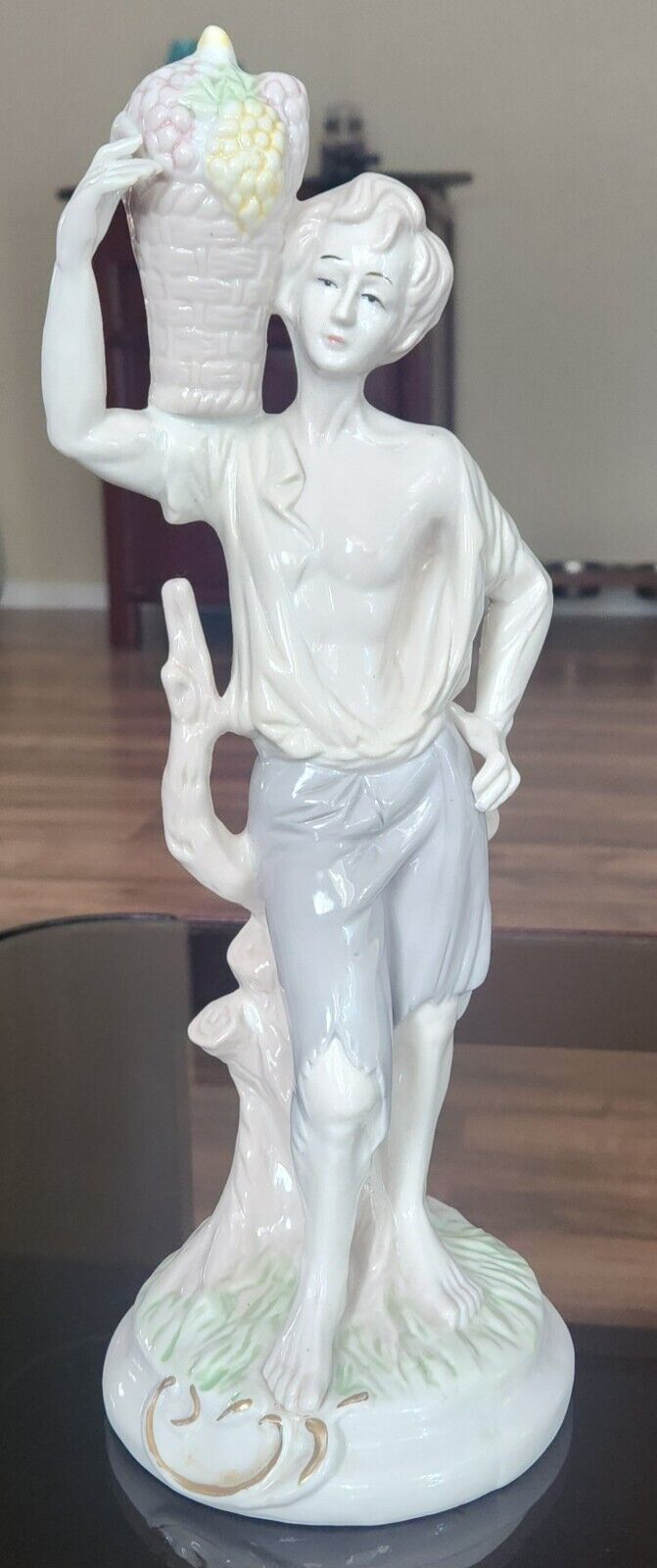 Vintage Porcelain Hand Painted Figurine Of Young Man Carrying Basket Of Grapes 