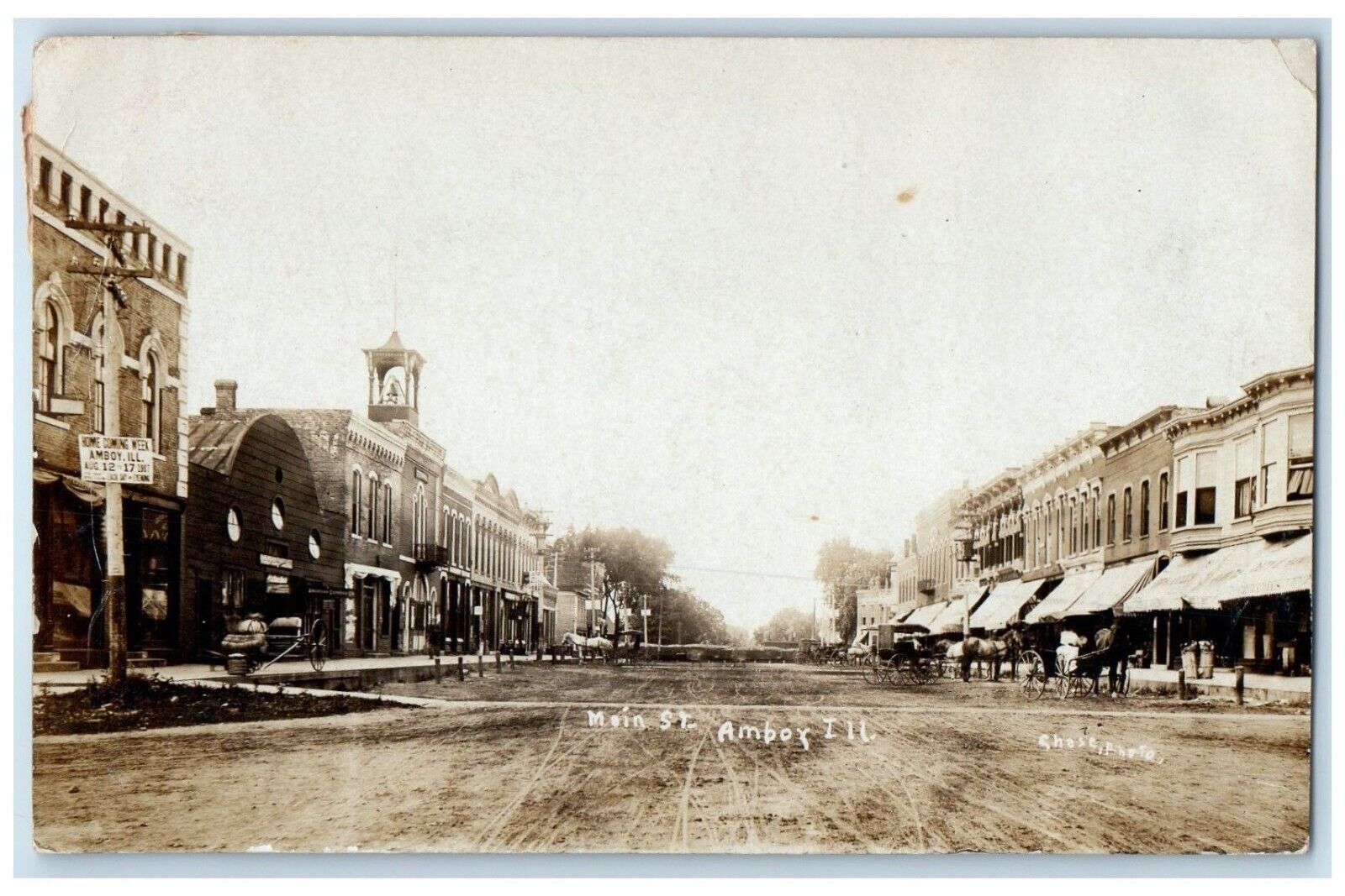 1908 Main Street Stores Horse Carriage Amboy IL Chase RPPC Photo Posted Postcard