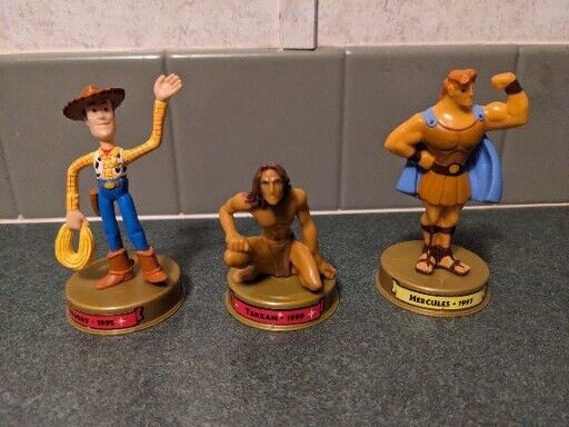 Disneyland 100 Years of Magic Mcd Toy Woody Tarzan Hercules 4\