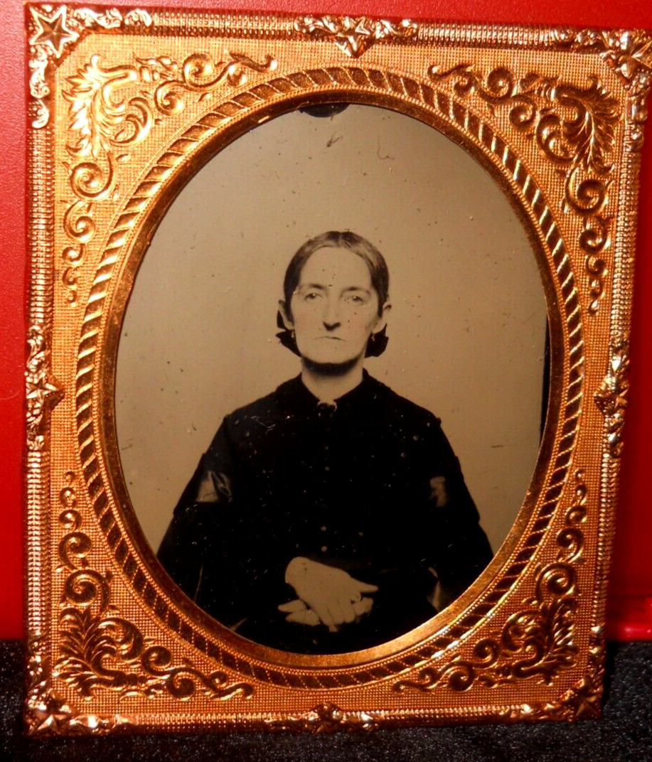 1/6th Size Ambrotype of older lady in brass mat/frame