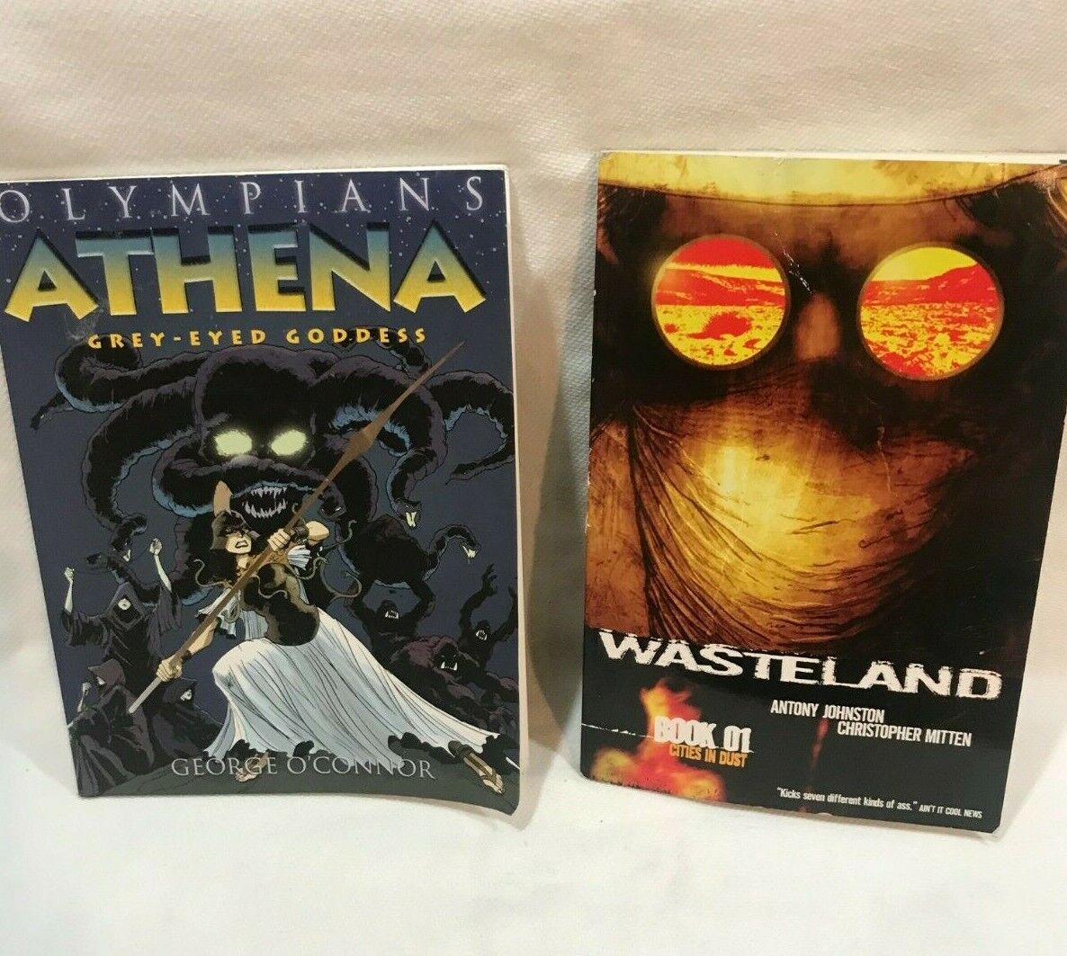 WASTELAND Book 1  & Olympians Athena,  Grey-Eyed Goddess   2 Graphic Novels