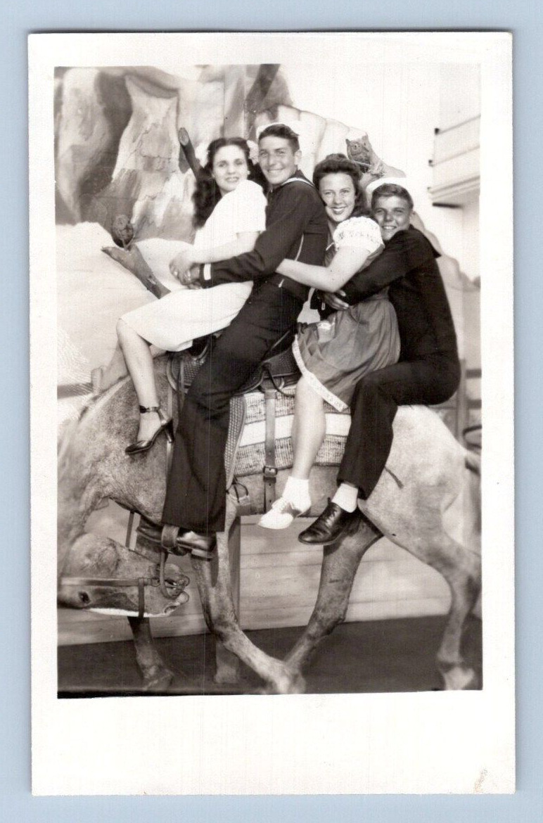 RPPC 1940'S. GIRLS & SAILORS ON DONKEY. POSTCARD MM27