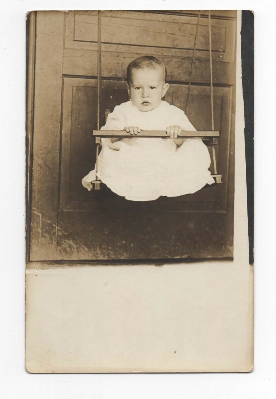 RPPC Baby Sitting In Rope Swing Porch Door Postcard GL13