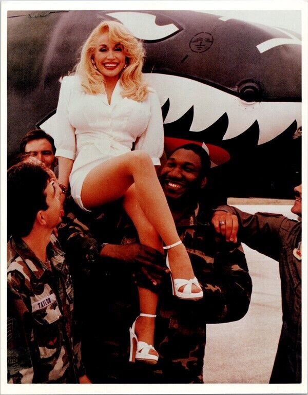 Dolly Parton gets a lift-up from military guys 8x10 inch photo