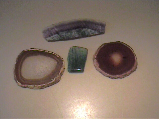 LOT OF VARIETY OF SLICED POLISHED OR CUT STONES