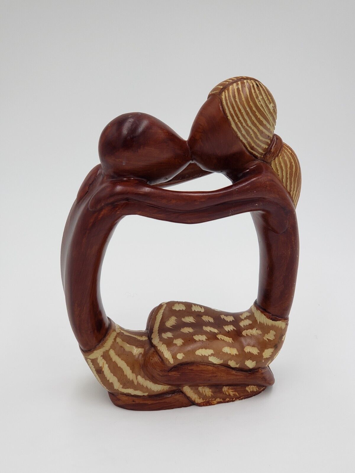 Abstract Stylized Sculpture of Two Lovers Kissing