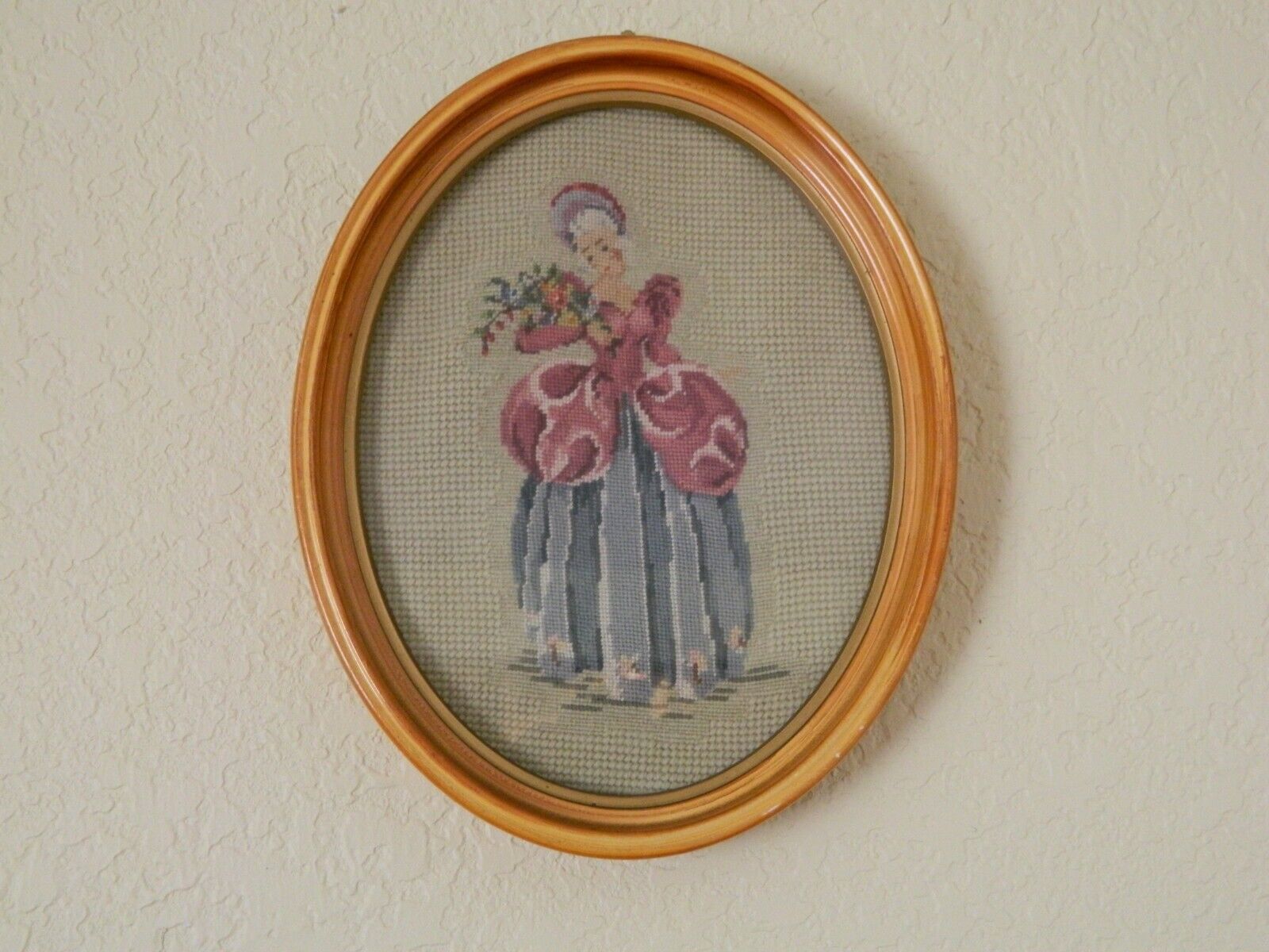 Vintage Needlework of a Woman in a Pink and Blue Dress with Flowers