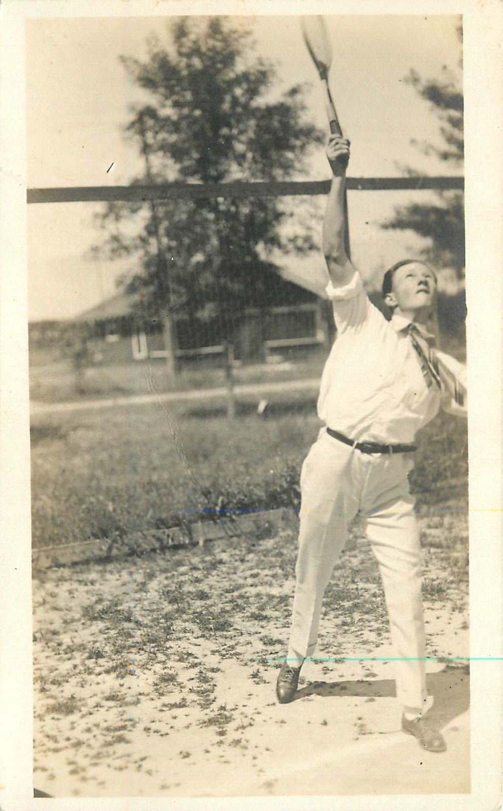 Postcard RPPC C-1910 Man playing tennis Sports action 23-1034