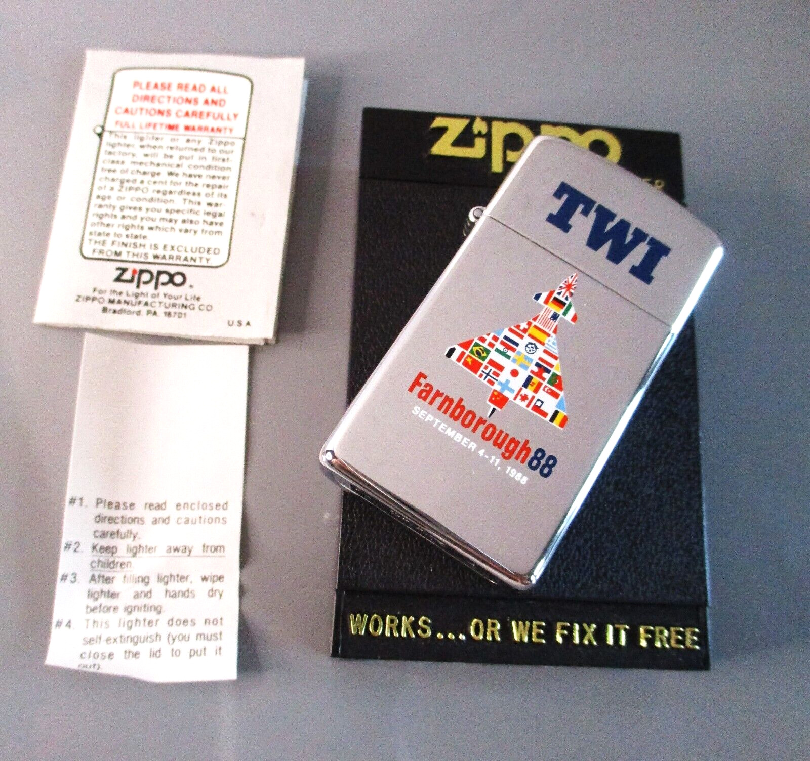 1988 ZIPPO SLIM CIGARETTE LIGHTER & BOX TWI & FARNBOROUGH INTERNATIONAL AIR SHOW