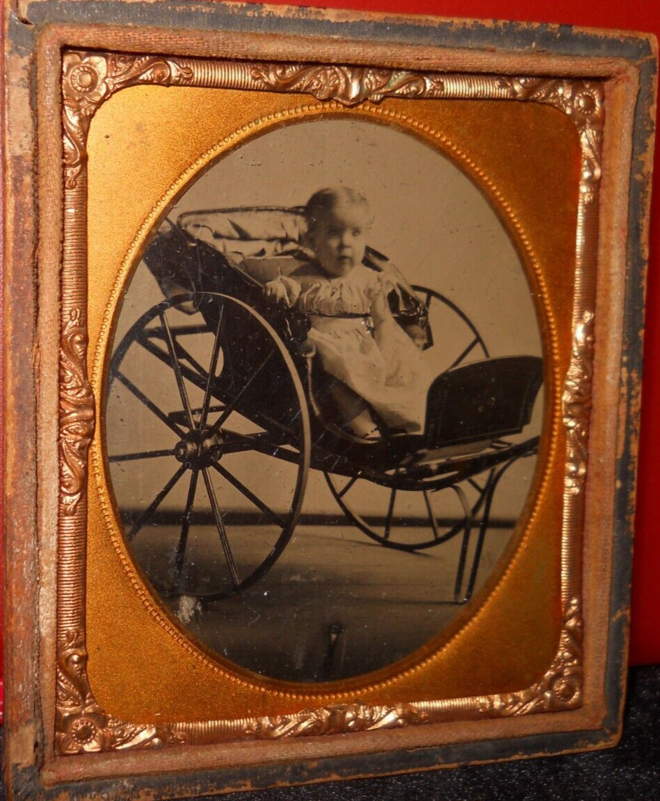 1/6th size Tintype of girl in buggy in half case