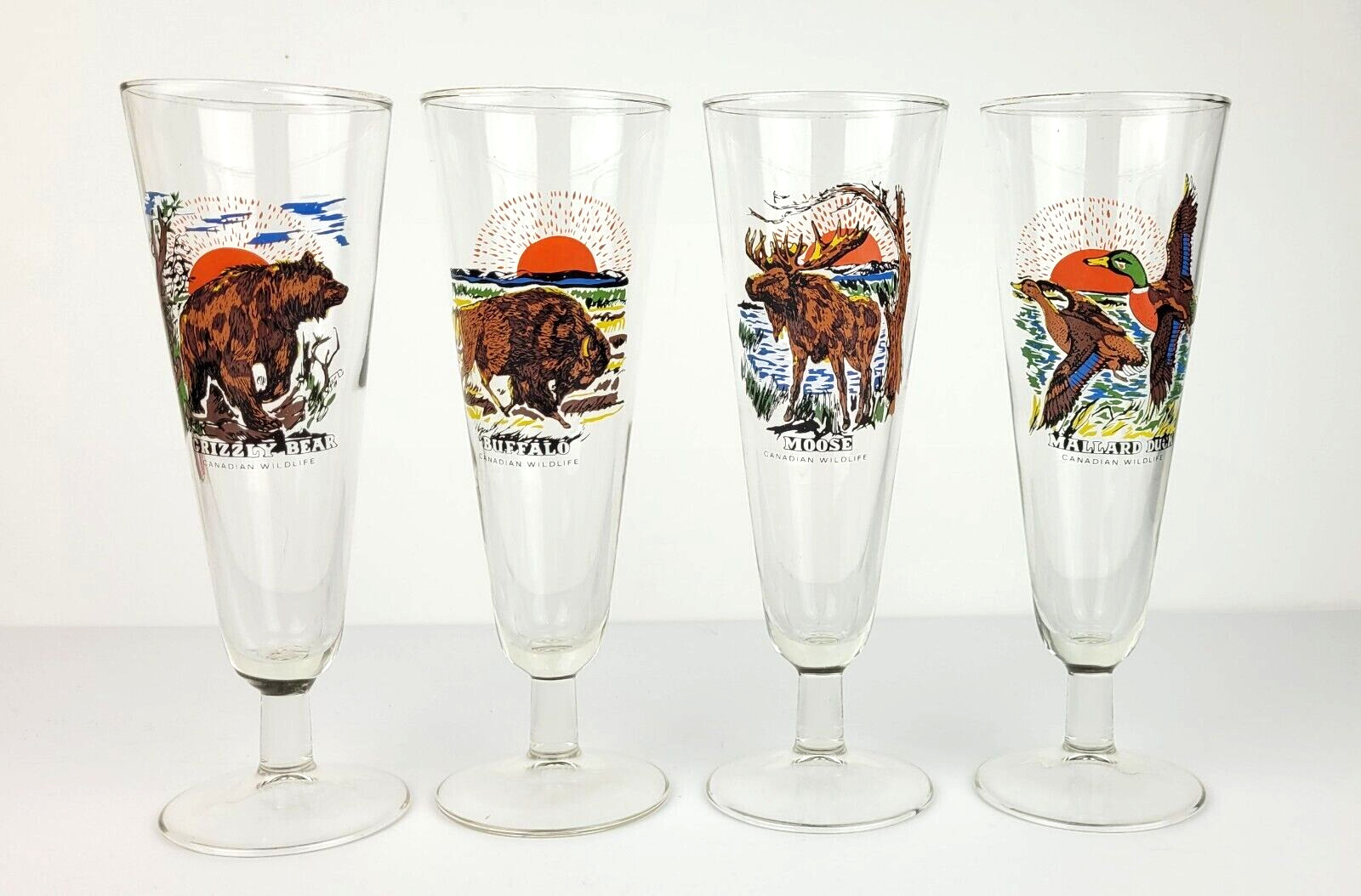 Set of 4 Vintage Canadian Wildlife Pilsner Glasses Mallard, Moose, Buffalo, Bear