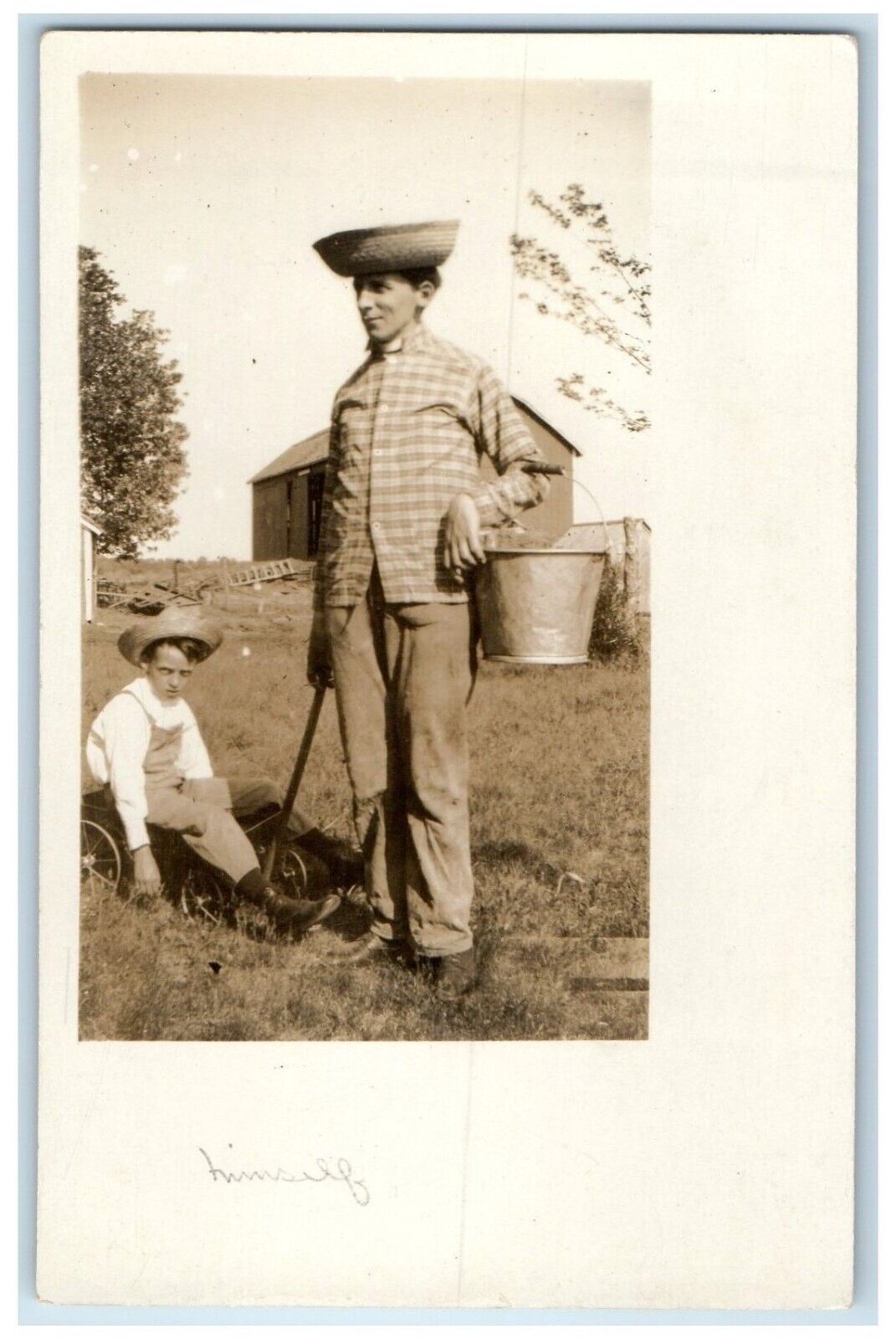 c1910's Father Son Goofing Around Humor Farm Toy Wagon RPPC Photo Postcard
