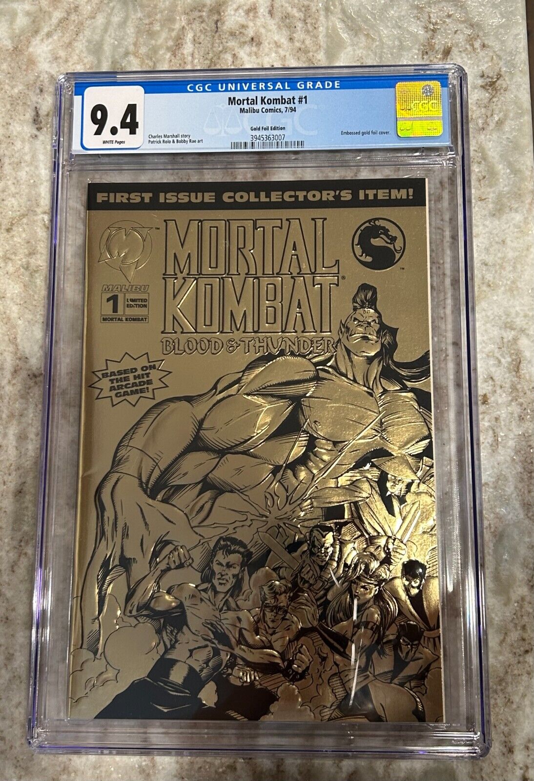 Mortal Kombat #1 - Embossed Gold Foil Edition Cover - CGC Grade 9.4