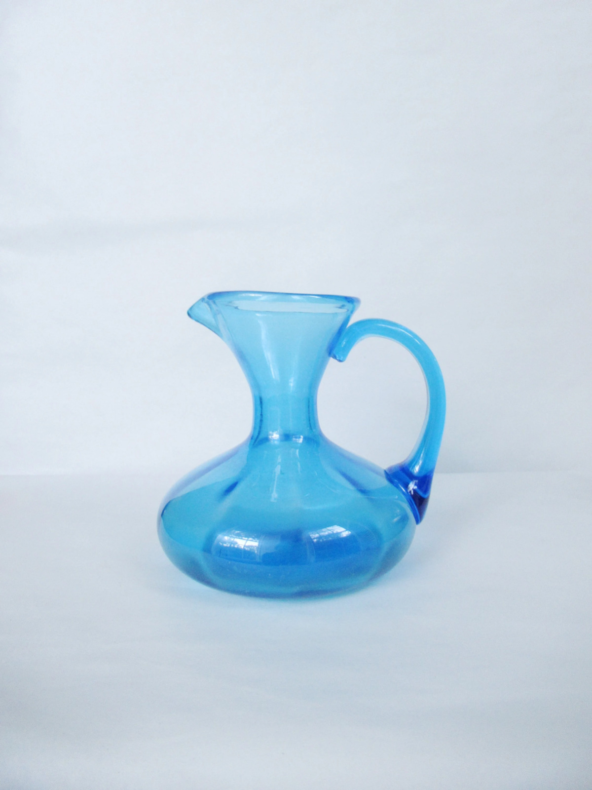 Small Blue Colored Skinny Neck Glass Pitcher Vase