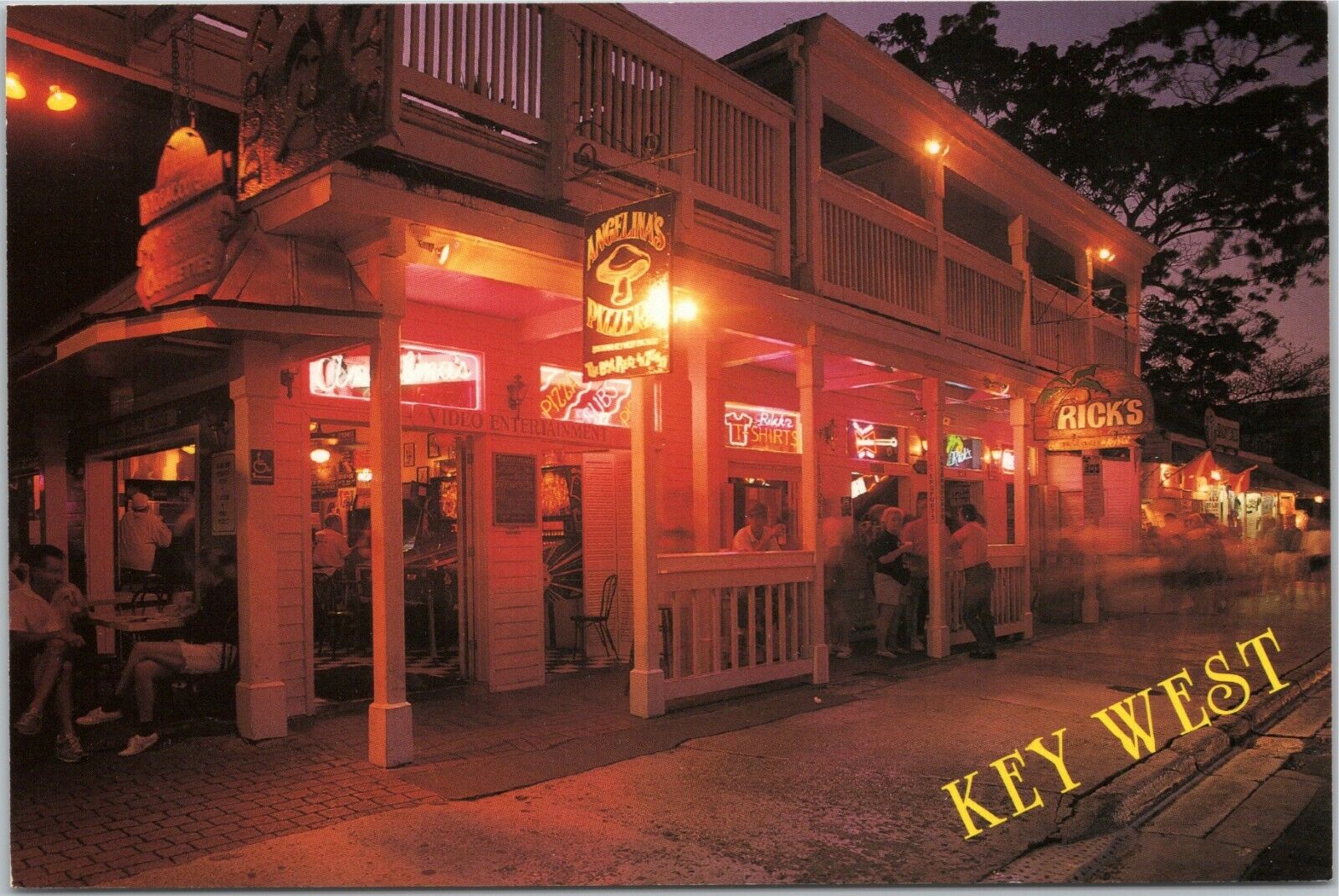 Key West - Duval Street, dusk view, Angelina\'s Pizzeria, Rick\'s bar FL postcard