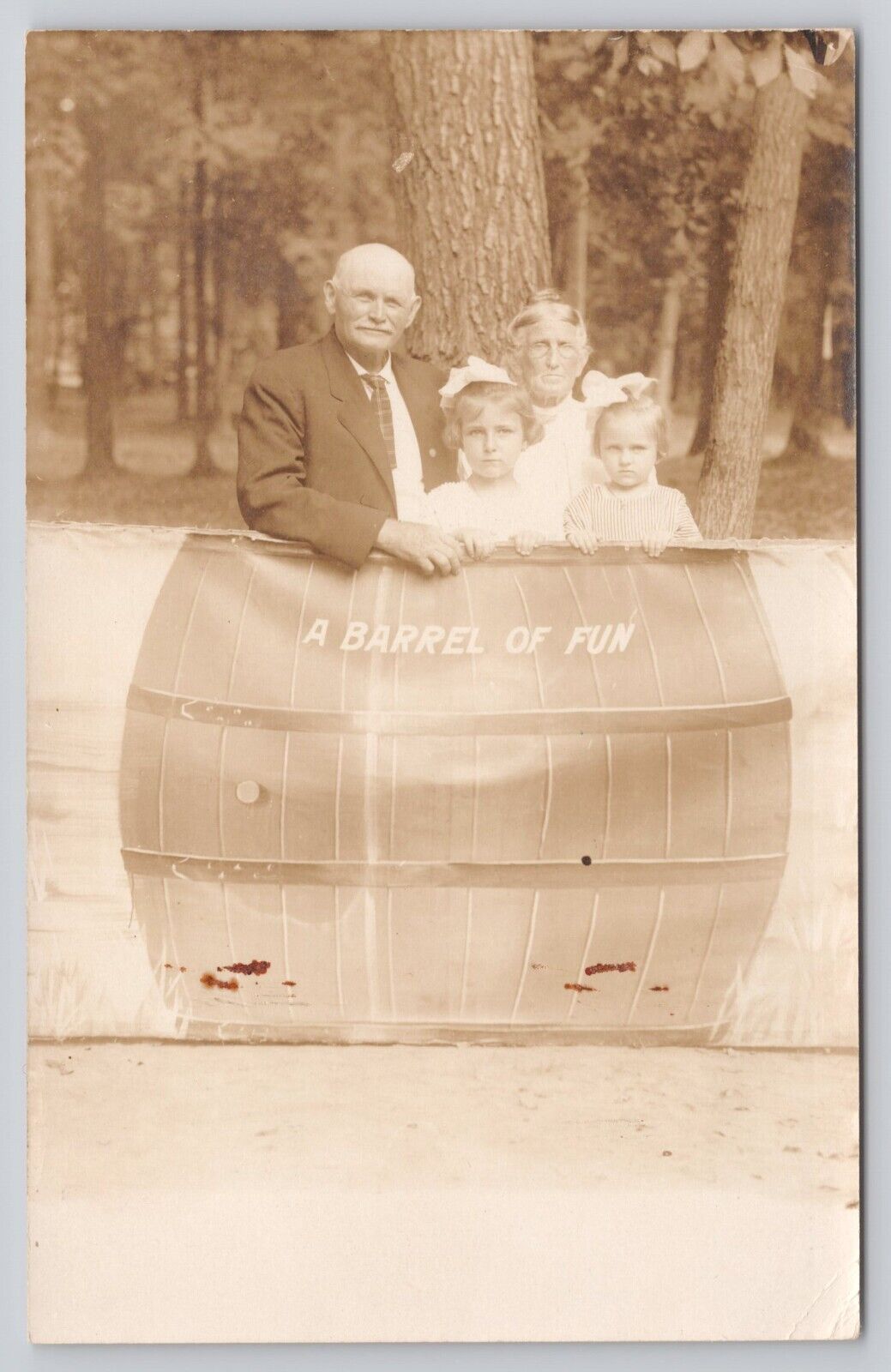 Barrel of Fun Prop Older Man Wife with 2 Young Girls c1904-1918 RPPC Postcard