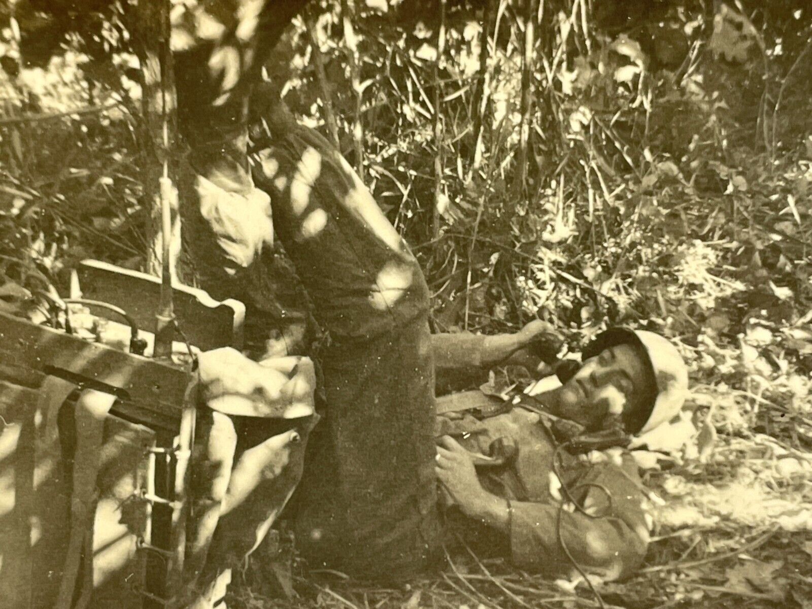 XA Photograph Handsome Military Soldier Laying On Back Jungle Telephone 1940-50s