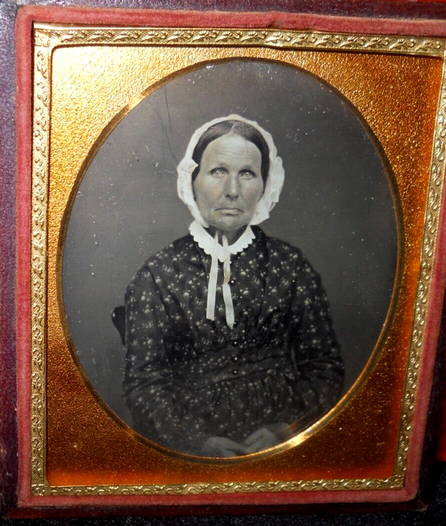 1/6th size Daguerreotype of lady with bonnet in half case