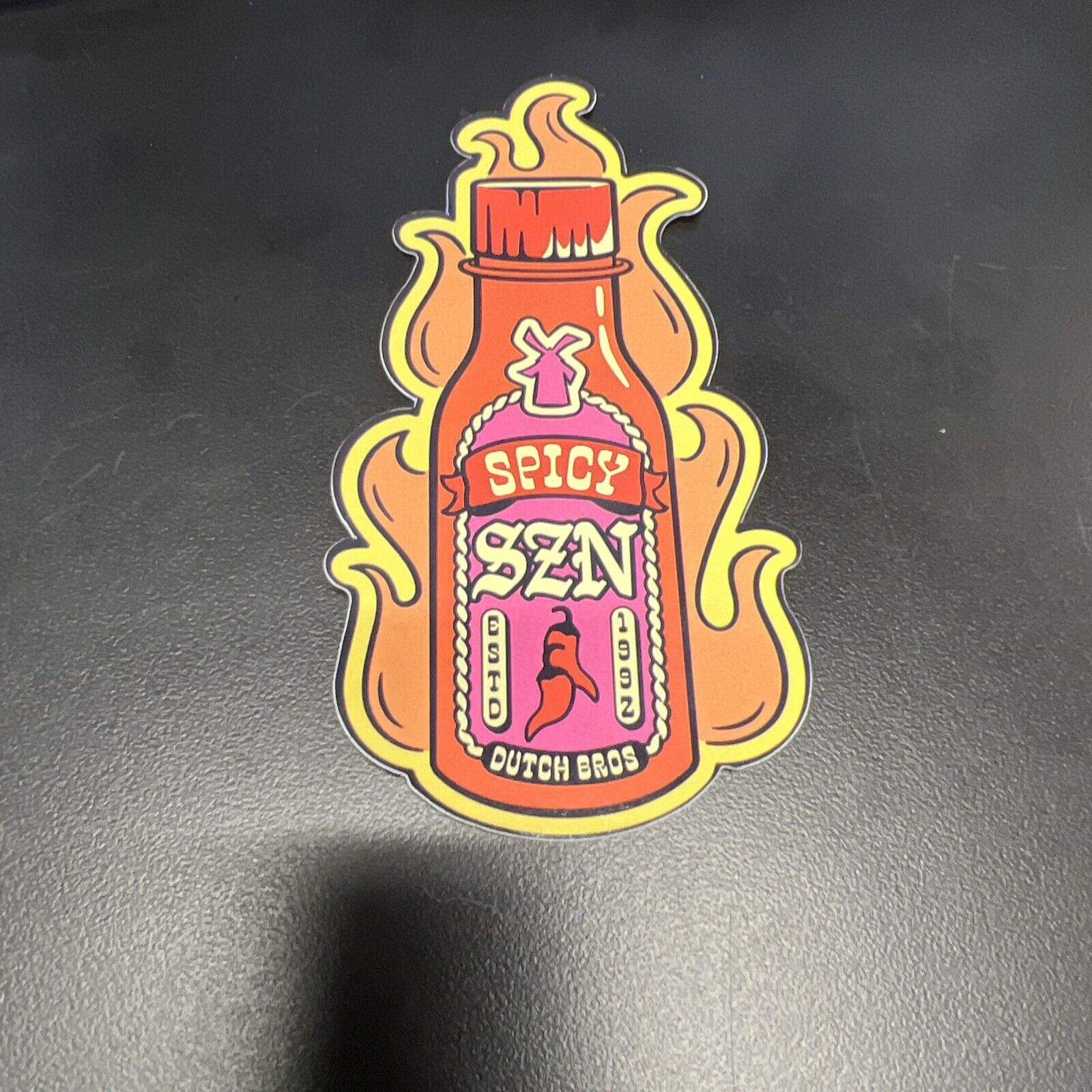 NEW Dutch Bros Sticker MAY 2023 Spicy SZN Hot Sauce Bottle Flames Windmill 1992