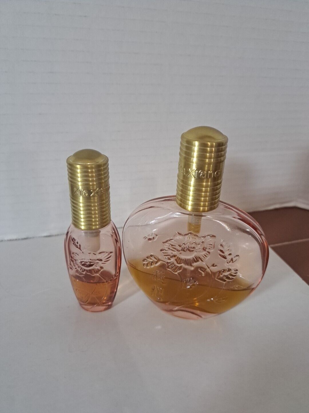 2 Bottles Of  Revlon Xia Xiang Cologne Spray Both About 35% Full.