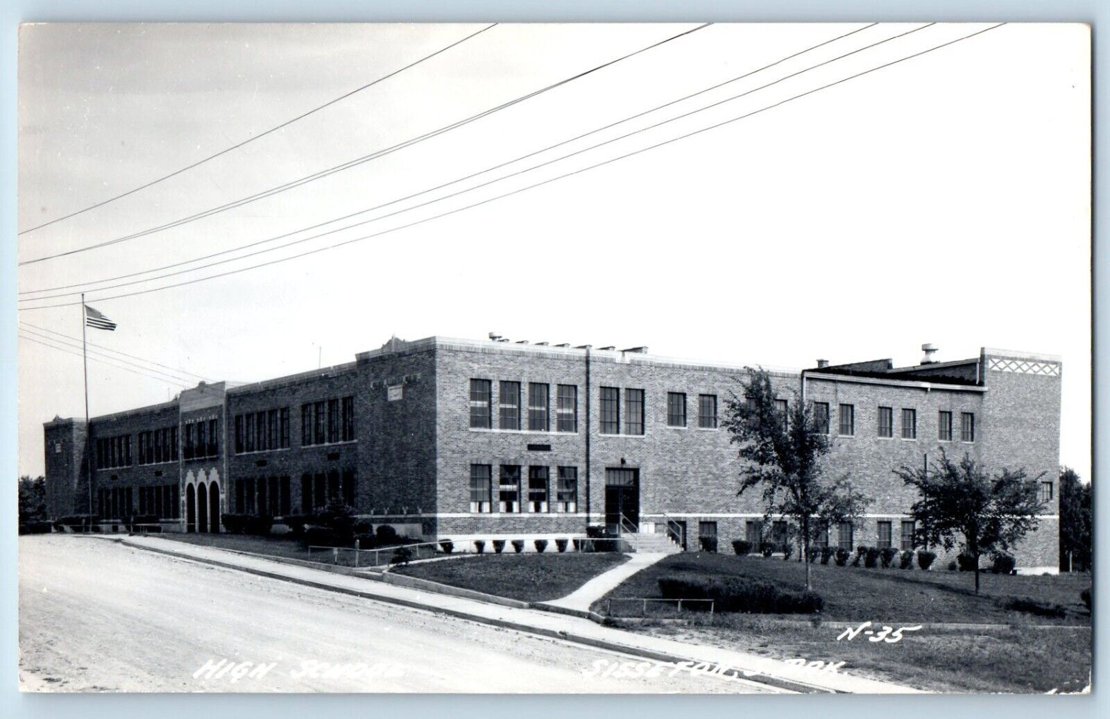 Sisseton South Dakota SD Postcard RPPC Photo High School Building Dirt Road 1949