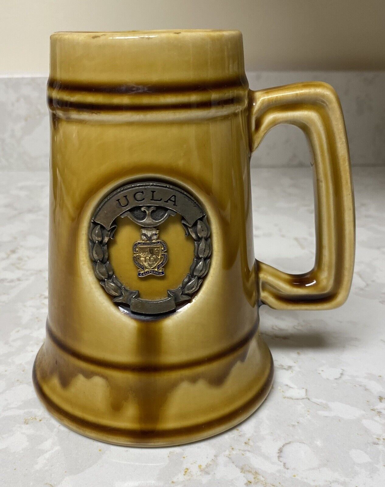 Early UCLA university beer stein with metal emblem in excellent condition