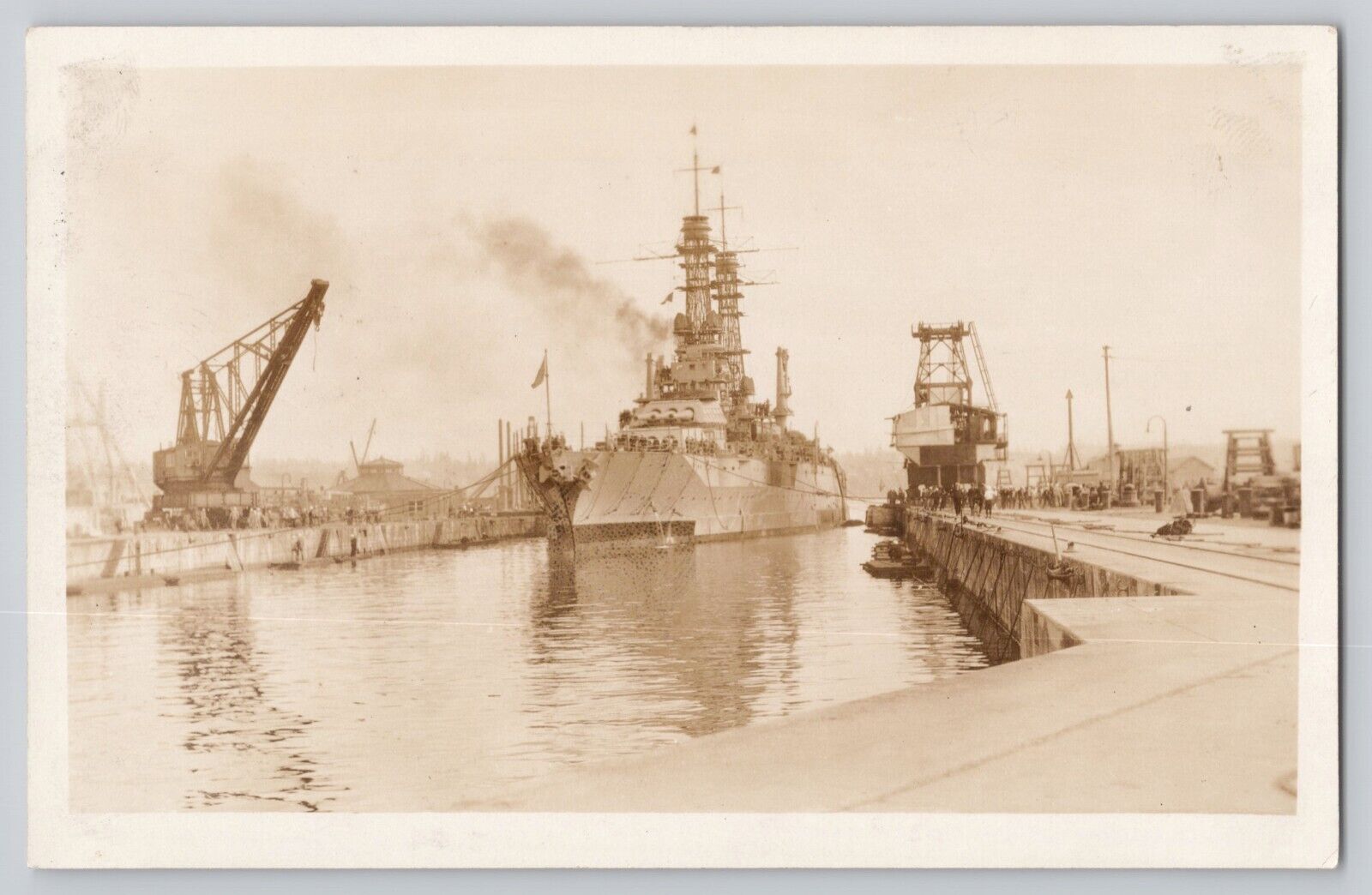 RPPC WWI Era US Battleship Entering Dry Dock Canal Postcard