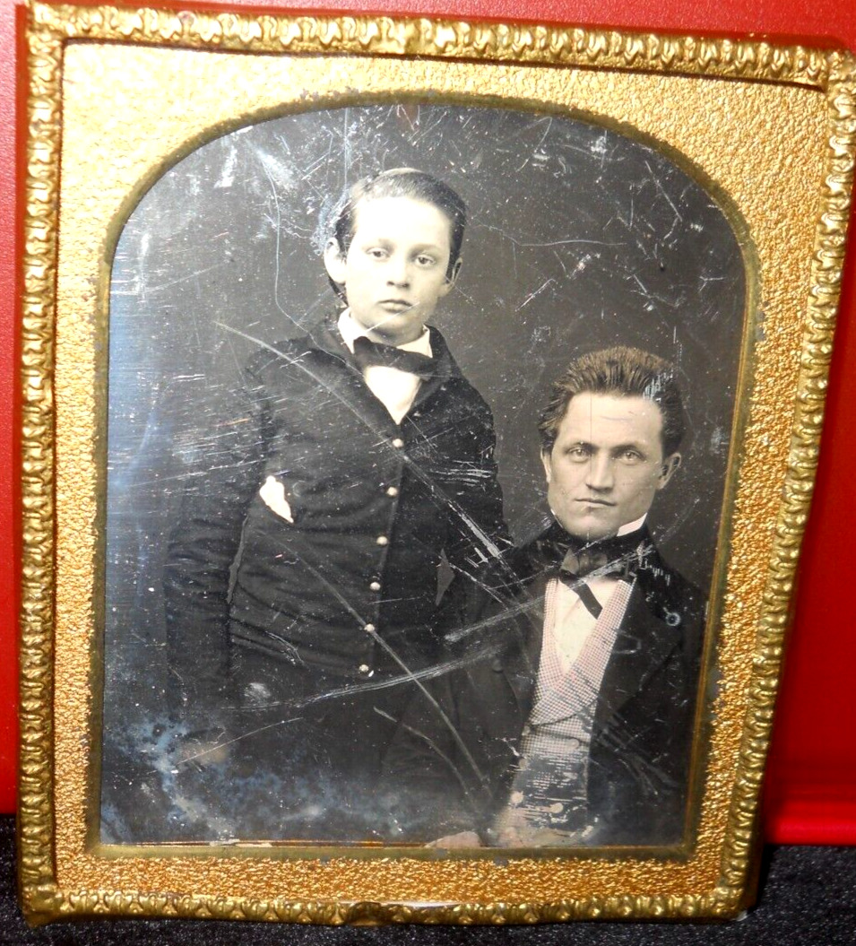 1/6th size Daguerreotype of man and son in brass mat/frame