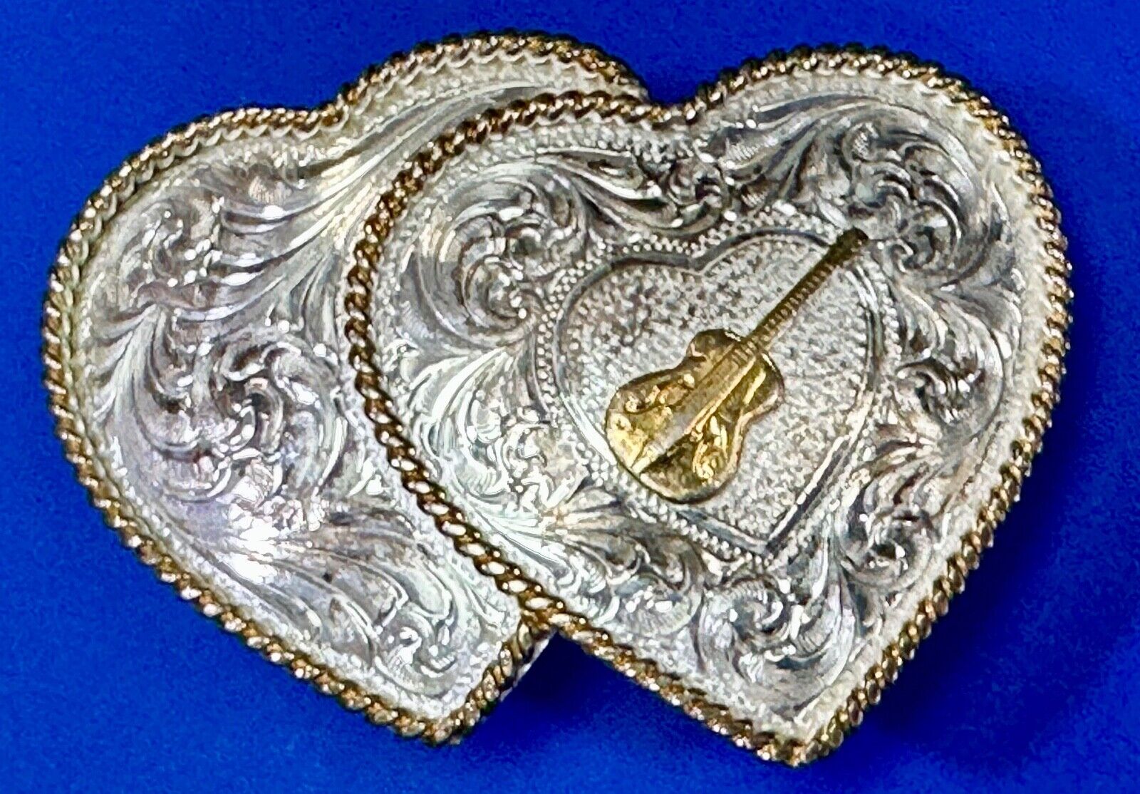 Guitar inside of dual hearts -Vintage Numbered Montana Silversmiths belt buckle