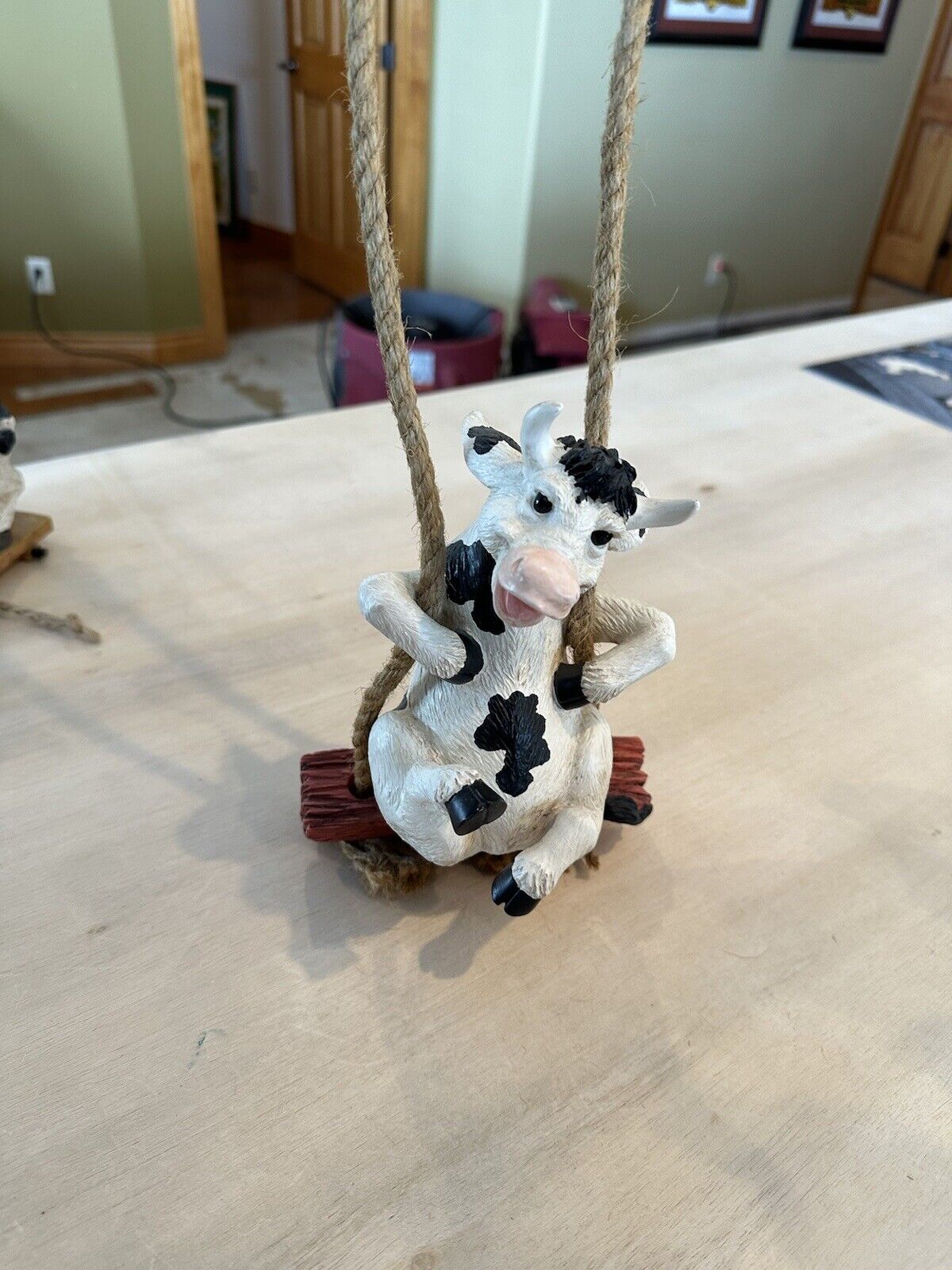 Vintage Black And White Cow On A Rope Swing