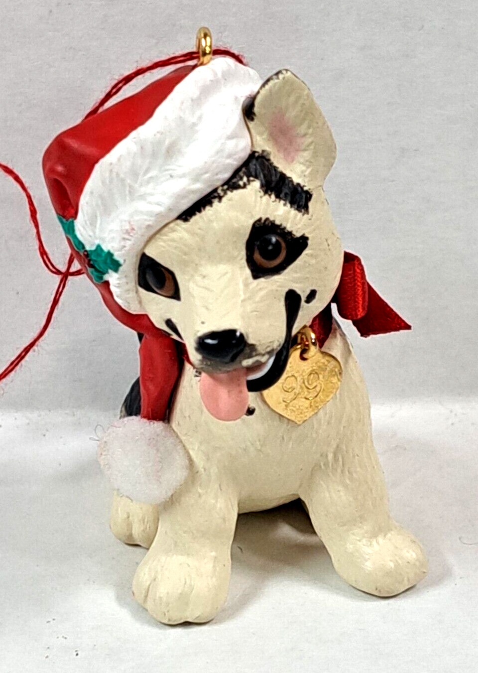 1999 Hallmark Cards Christmas ornament Dog puppy pre-owned 2 1/4 inch tall