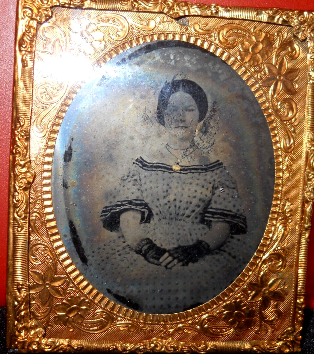 1/6th Size Ruby Ambrotype of young lady in brass mat/frame