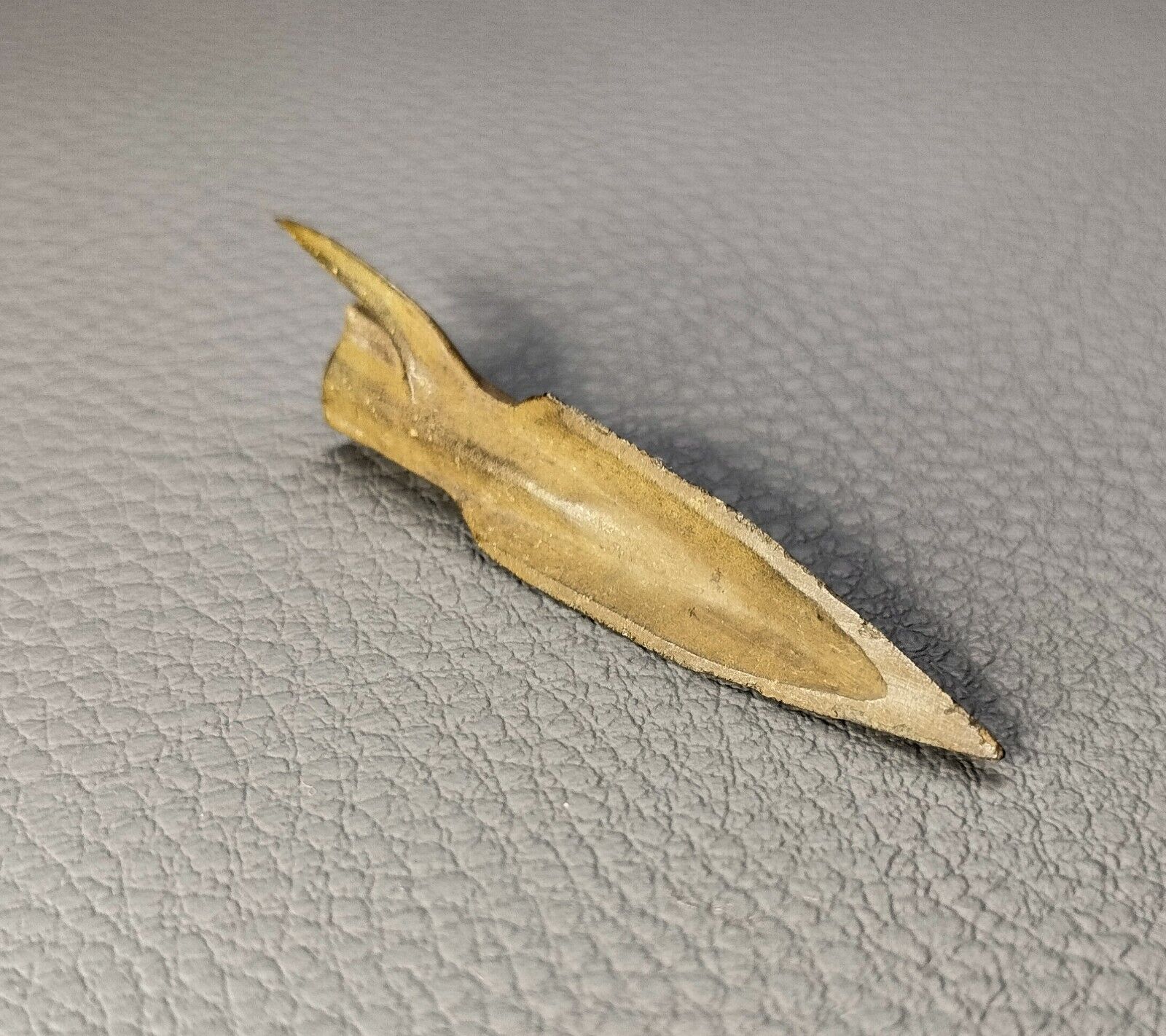 Ancient Scythian arrowhead. Archaeological find. Scythian artifact.