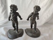 Pair of Bronze Cast Iron Cherub Boy Child Bookends .7/1/2 tall.Broken 1 Leg . picture
