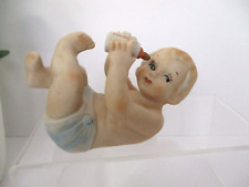 Vintage Bisque Piano Baby Laying on Back Holding Bottle Blue Diaper Blonde Hair picture