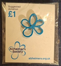 Charity pin badge blur flower alzheimers society picture