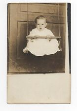 RPPC Baby Sitting In Rope Swing Porch Door Postcard GL13 picture