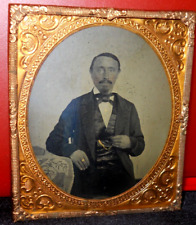 1/6th size Tintype of man in brass mat/frame picture