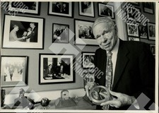 1992 Glenn Seaborg holding a radiation detection device in his office picture