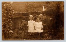 RPPC Two Small Girls in White Dresses By Fence AZO 1904-18 ANTIQUE Postcard 1506 picture
