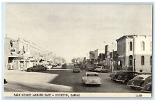 c1920 Main Street Looking East Exterior Building Cars Stockton Kansas Postcard picture