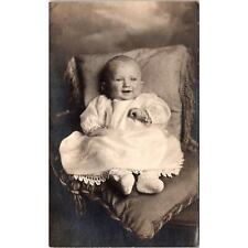 RPPC Baby in Dress Smiling Sitting on Pillows Vintage Real Photo Postcard picture