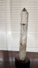 clear quartz tower 16 inches with a wooden stan picture