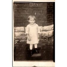 RPPC Child Girl Standing by Brick Wall Azo Vintage Postcard Real Photo picture