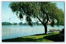 Warsaw Indiana IN Postcard Lake Winona Trees Canoe Boat Flag c1960's Vintage picture