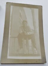 Antique Real Photo Postcard Man Sitting on a Railing picture